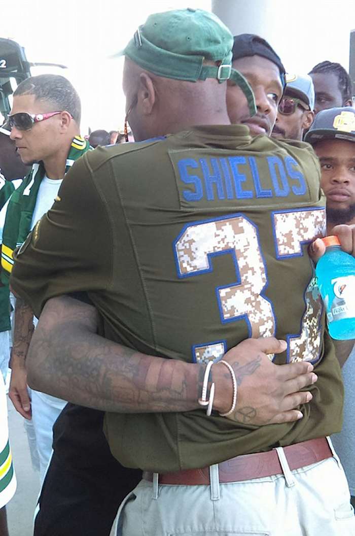 Father and son hug after the Jacksonville game in 2016.